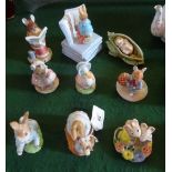 A collection of nine Beatrix Potter figurines, to include: a Frederick Warne & Co musical figure,