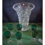 A harlequin set of six green glass wine glasses,