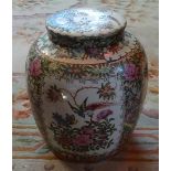 A large Chinese Famille Rose ginger jar and cover, profusely decorated with birds,