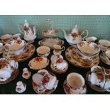 A large quantity of Royal Albert old Country Roses tableware, to include: teapot, coffee pot,