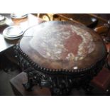 A Chinese rosewood jardiniere stand, having a lobed bead decorated inset marble top,