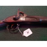 A 19th century side lock pin fire sporting gun with walnut stock.