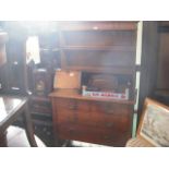 An Edward oak dresser of small proportions, the rack with two open shelves,