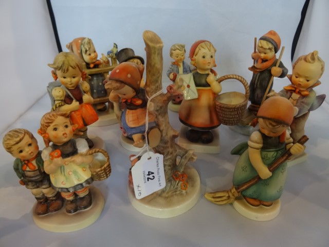 A collection of ten Hummel figures, various, including: young girl skiing,