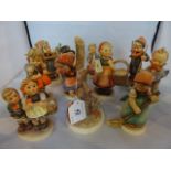 A collection of ten Hummel figures, various, including: young girl skiing,