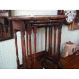 A nesting set of three Edwardian walnut veneered occasional tables.