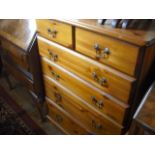 A modern pine chest of two short and four graduated long drawers on bracket plinth.