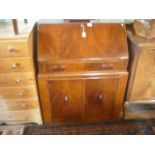 A circa 1930's walnut veneered bureau.