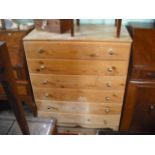 A contemporary pine chest of six long drawers on bracket feet.