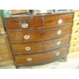 An early 19th century mahogany veneered chest of bow front form,