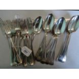 Wakely & Wheeler, eleven silver tablespoons and twelve silver dinner forks, London 1917.