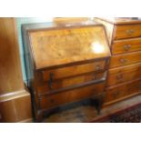 A 1930's walnut veneered bureau.