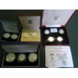 Four cased sets of proof coins,