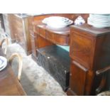 A William IV mahogany sideboard, the bow front drop centre with three frieze drawers,