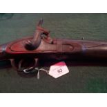 A 19th century side lock sporting gun with walnut stock.