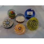 Six paper weights, including: millefiore, bubble and others.