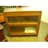 An oak two tier Globe Wernicke-type bookcase.