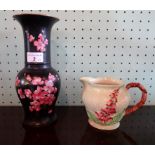 A Wiltshaw & Robinson Carlton Ware vase, having pink prunus decoration on a black ground, (25cm),