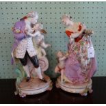 A pair of Continental porcelain figurines of imposing proportions, a smartly dressed lady and man,