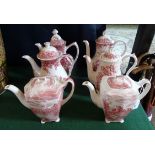 A collection of six red and white printed transfer ware coffee pots,