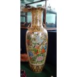 A large modern Japanese floor standing vase, profusely decorated with birds, butterflies,