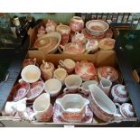 Two boxes containing a large quantity of red and white printed transfer ware,