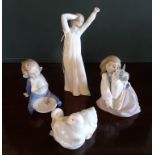 Four Nao figurines to include: a young girl with a rabbit, a baby and others.