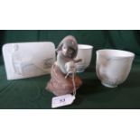 A Lladro figurine of a girl holding a lamb, numbered 5484,