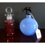 An interesting blue opalescent glass jar of globular form, having an elephant stopper,