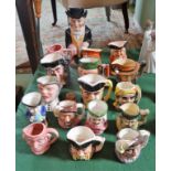 A good collection of character toby jugs, including one early example with removable hat cover.