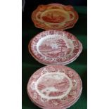 A collection of red and white transfer printed serving platters,