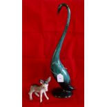 A green glazed ceramic model of a stylized swan, together with a ceramic Beswick-style donkey.