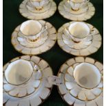 A set of six Royal Vale bone china trios, comprising: tea cups, saucers and side plates,