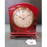 A wooden red painted Japanned mantel clock,