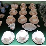 A set of twelve Royal Albert Tranquility pattern trios, together with an open sugar bowl and others,