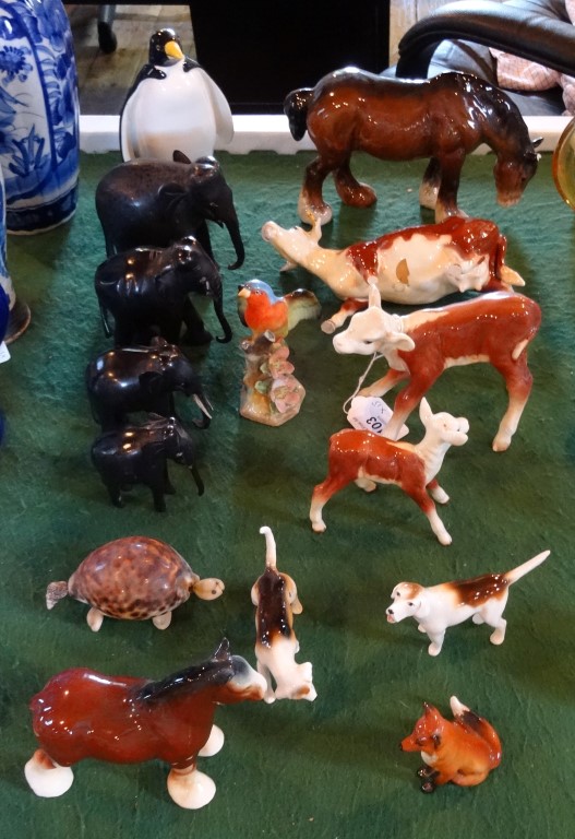 A mixed quantity of animal figurines, to include: a Beswick seated fox and two hounds,