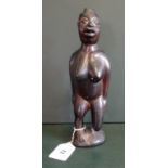 An East African (possibly Malawi or Rwanda) hardwood ebony figurine of a woman standing on one leg