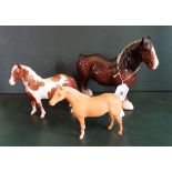 Three Beswick horses, to include a Palomino gloss example.