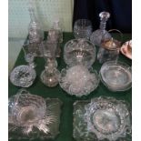 A mixed lot of pressed and cut glassware, to include: decanters, fruit bowls, comports,