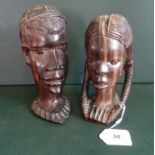 Two African hardwood busts of a man and a woman, the tallest (19cm).