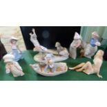 Seven Continental ceramic figurines, to include Nao and Lladro examples.