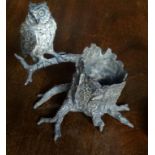 A cold painted bronze figure of an owl perched beside a tree stump, signed Bergmann, stamped 14 (16.