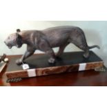 A large Art Deco model of a prowling panther, signed Rulas,