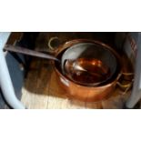 A copper and brass twin handled oval pan, together with three other copper items.