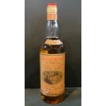 A bottle of Glenmorangie Highland Malt Scotch Whisky, 10 years old, bottled in the 1970's, 75.