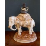 A late 19th century Alfred Stellmacher Turn Teplitz porcelain oil lamp in the form of an Indian