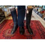 A pair of lady's black leather riding boots with wooden trees, labelled Jackson & Son, London. SW1.