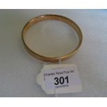 A large 15 carat gold bangle, 19 grams.