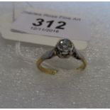 A single stone diamond ring, the brilliant cut diamond within a raised scalloped mount,