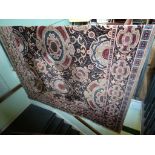 A large patterned machine made carpet (364cm x 274cm).